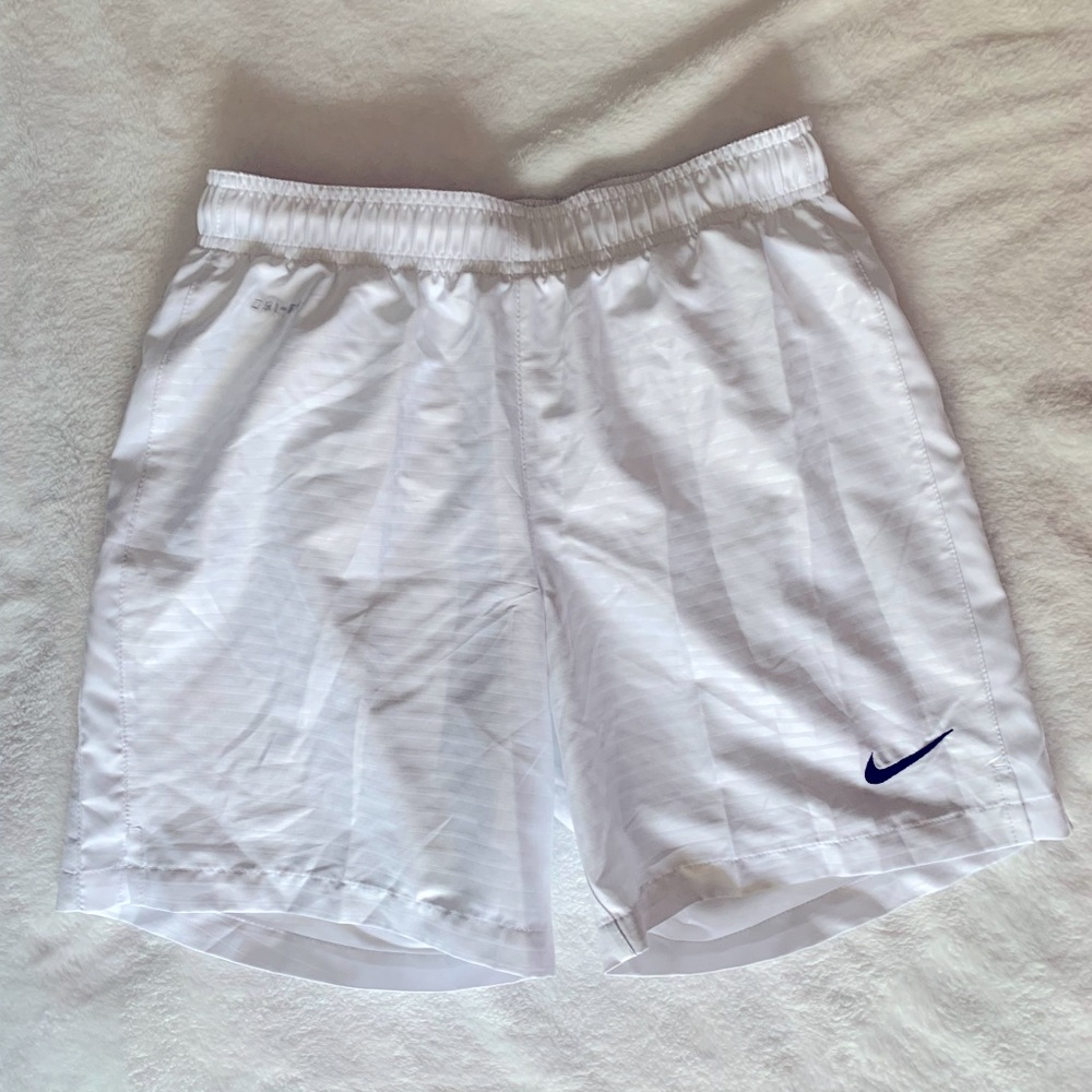 Women’s Nike  basketball shorts, white, size small.